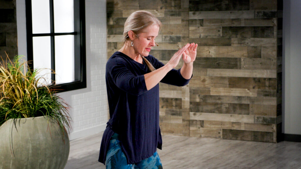 Wellbeats instructor Barb K. practices Tai Chi.