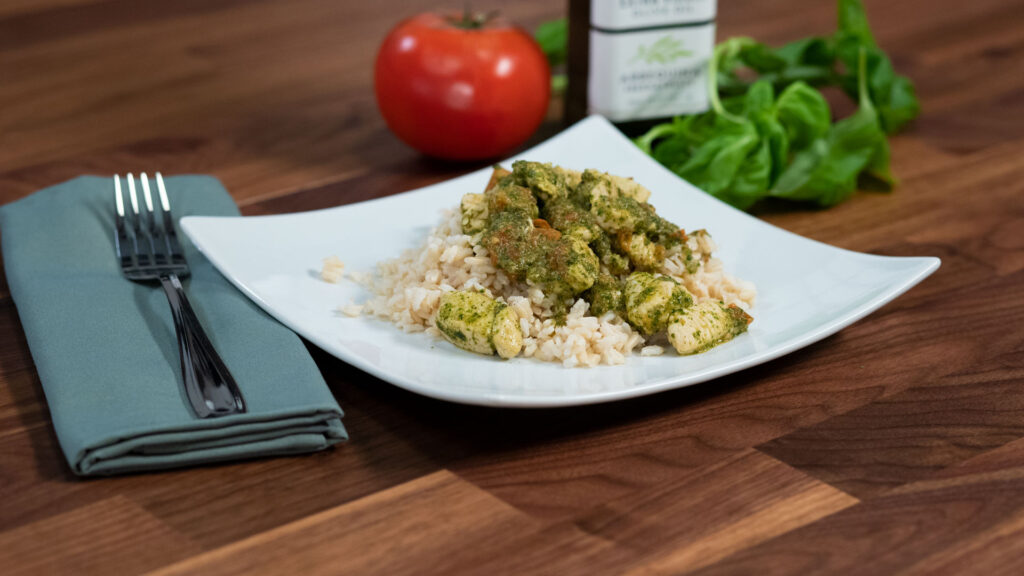 A plate of chicken pesto and rice