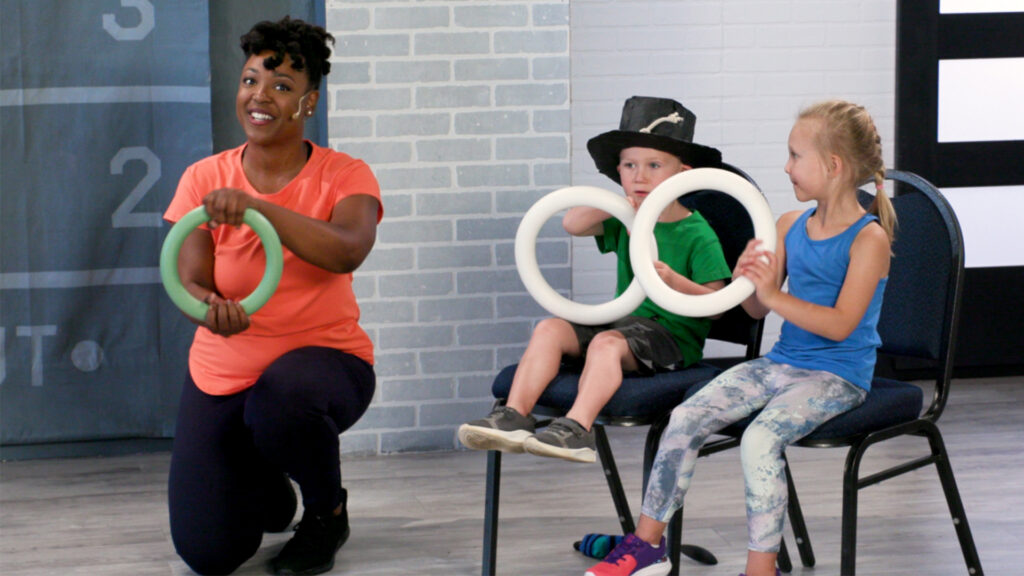 Wellbeats instructor Lynnea D leads the kids fitness class Animals Barnyard