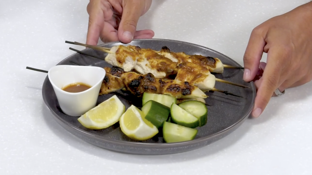 A plate of chicken satay